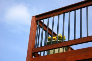 Railings of wood deck stained brown.