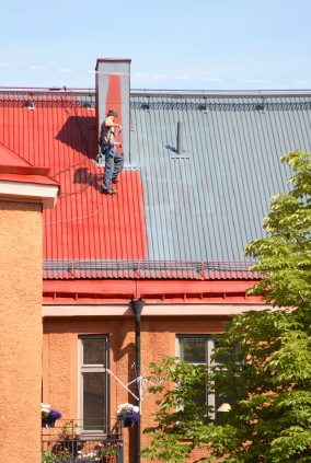 Roof painting in Rye Brook, NY by Sterling Paint Corp..